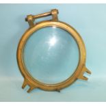 A bronze glazed porthole cover, 41cm.