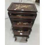 A nest of four 20th century oriental hardwood tables inlaid with mother of pearl prunus and