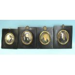 Two 19th century miniature portraits of young men, painted on ivory, each within oval gilt metal