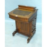 A Victorian walnut Davenport desk, 54cm wide, 84cm high.