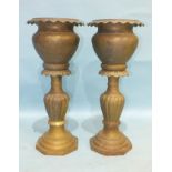 A pair of early-20th century brass jardinière stands, 70cm high, 30cm diameter, (2).