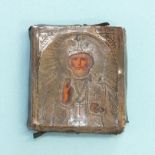 A 19th century Russian icon, the silver mounted depiction of St Nicholas with painted face and