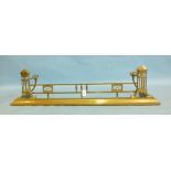 A Victorian brass fire kerb of Art Nouveau design, 118cm long, fire irons and other items.