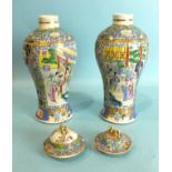 A pair of mid-18th century Chinese Canton style vases decorated with court scenes and butterfly