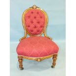 A Victorian walnut inlaid button-back salon chair, the oval back and upholstered seat on short