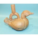 An antique Peruvian or Inca terracotta drinking vessel in the form of a duck, with some original