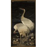 A Chinese silk-work wall hanging depicting two cranes standing among waterlilies, 110 x 59cm, (