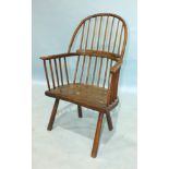 A late 18th/early 19th century ash and elm primitive stick-back chair with comb back and solid