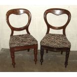 Eleven similar Victorian mahogany balloon-back dining chairs, all with drop-in seats on turned