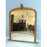 A Victorian gilt gesso over-mantle mirror surmounted by a cherub, 130 x 94cm.