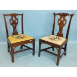 Two George III mahogany dining chairs, each with pierced vase splat and drop-in seats, on square