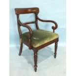 A William IV mahogany carver chair with curved bar back and drop-in seat, on turned and carved