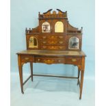 A late Victorian bureau de dame, the upper part fitted with four small mirrored cupboard doors and