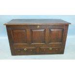 An antique oak mule chest with lift lid, candle box and two drawers, 123cm wide, 53cm deep, 71cm