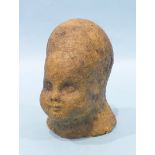 A 20th century matt-glazed pottery sculpture of a child's head, 11.5cm high, impressed figural