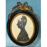 An early-19th century painted silhouette portrait of a lady, circa 1820's, painted in black with