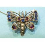 An early-20th century butterfly brooch set with sapphires, rubies, rose-cut diamonds, (one setting