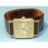 An 18ct-gold-cased tank wrist watch, the square face signed 'Boucheron', with 3, 6, 9 and 12