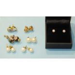 A pair of unmarked ear studs set moonstones, a pair of 9ct tri-colour gold knot ear studs, four