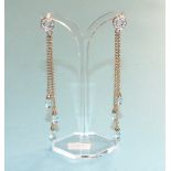 A pair of blue topaz and diamond chandelier earrings, each with a diamond point set circlet, from