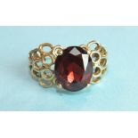 A garnet-set ring with unmarked gold mount, (tests as 9ct approximately), size P, 5.4g.