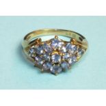 A tanzanite cluster ring in 9ct gold mount, size L, 2.9g.