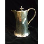 A plain hot water jug with flared circular base, Sheffield 1930, ___12½oz.