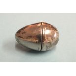 A William IV silver nutmeg grater in the form of an egg, maker Joseph Willmore, Birmingham 1830, 4cm