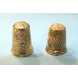 Two yellow metal thimbles, sizes 6 and 7, (2).