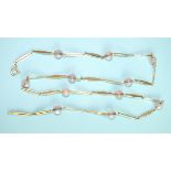 A 14k gold necklace of fancy links interspersed with rose quartz beads, marked '585', 62cm long,