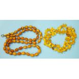 A string of graduated 'butterscotch' amber beads, largest 12mm x 9mm, 77cm long, 31g and a modern