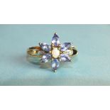 A tanzanite and opal cluster ring with diamond-point-set split shoulders and 10k gold mount, size N,