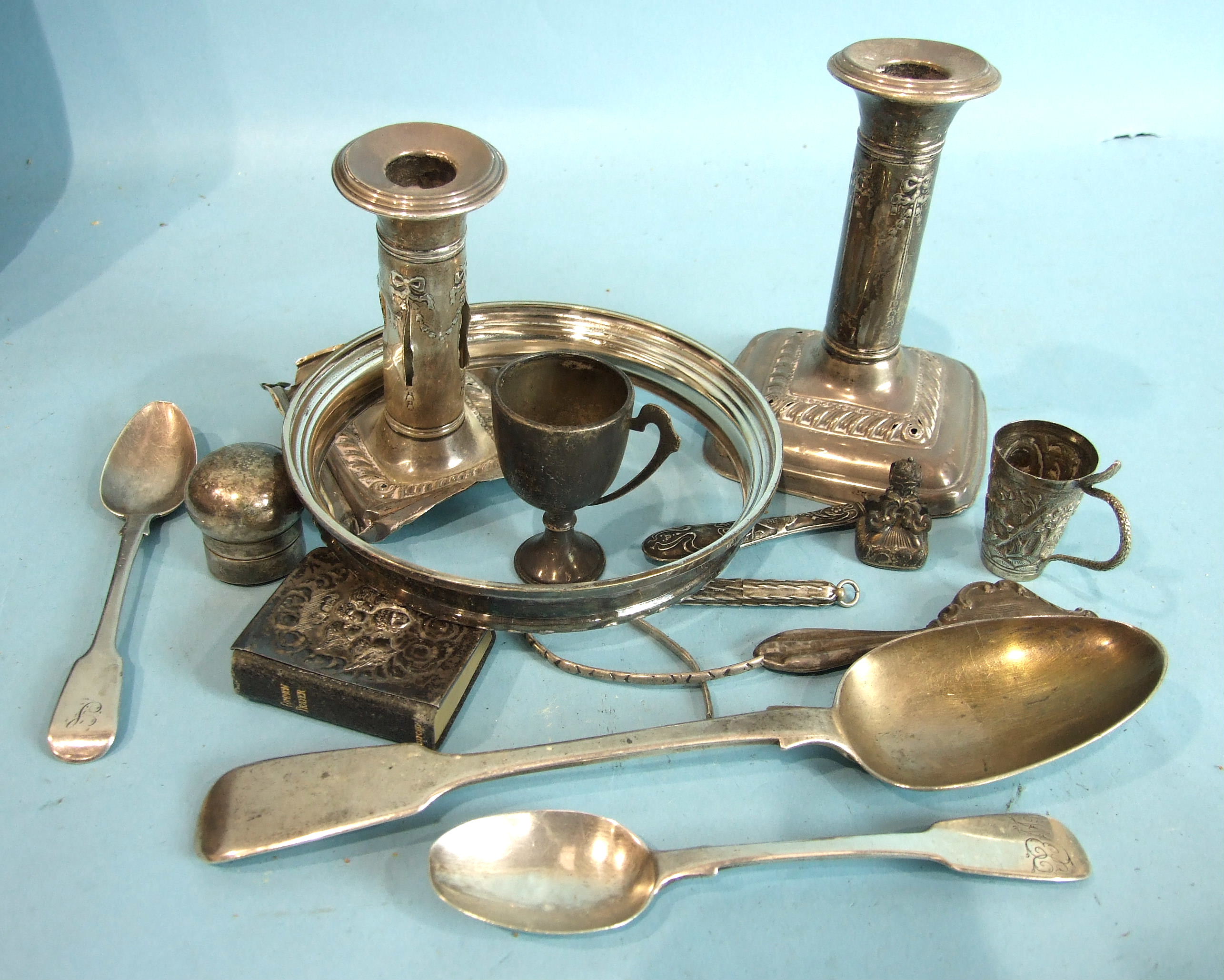 A silver bowl rim, two damaged loaded short candlesticks and other scrap silver, approximately