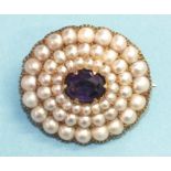 A late-Victorian amethyst and pearl brooch claw-set an oval amethyst within three concentric oval
