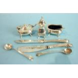 Two Georgian mustard spoons and a three-piece condiment set, Sheffield 1965.