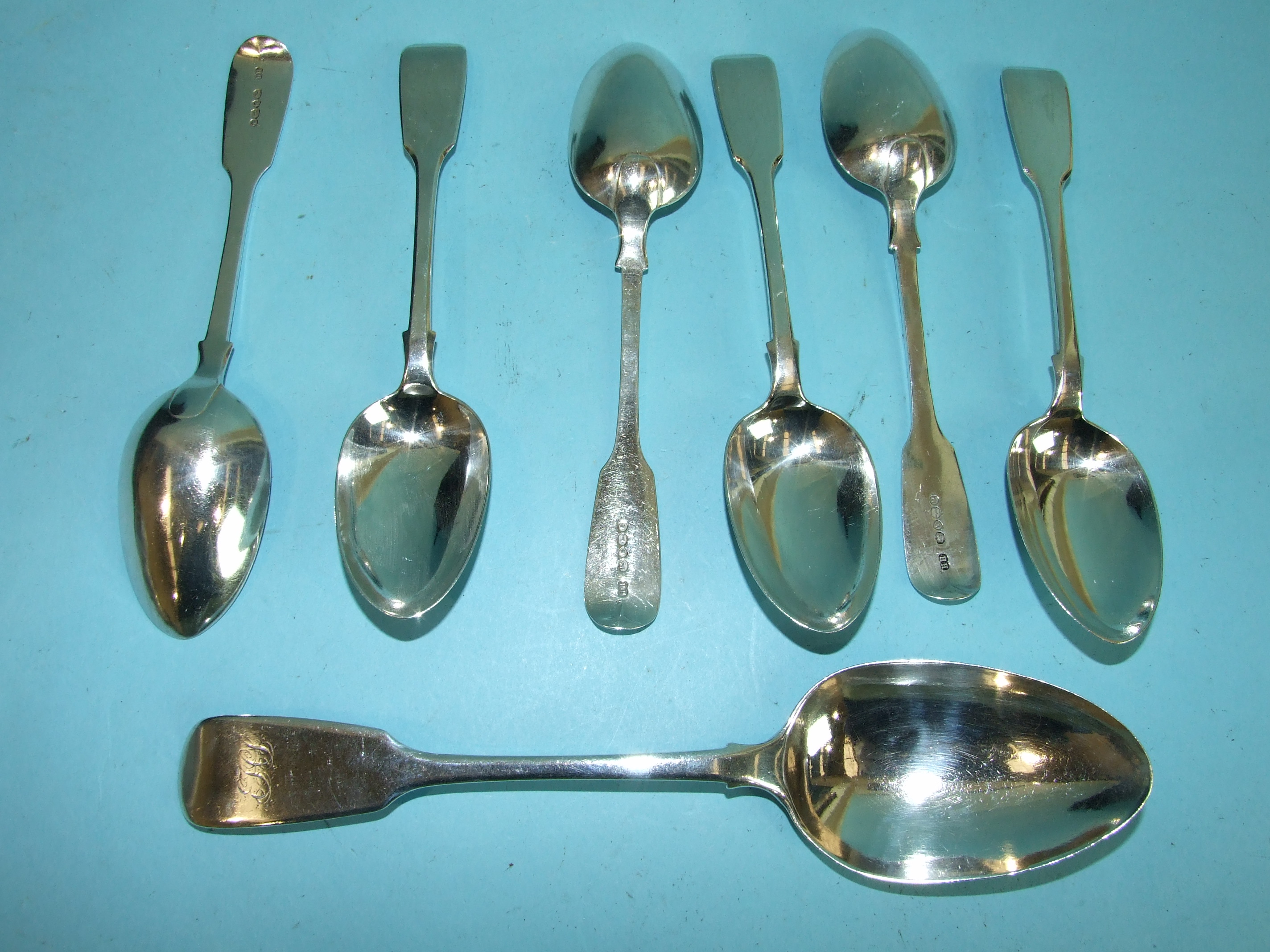 A set of six Victorian fiddle pattern dessert spoons, London 1864 and an Exeter tablespoon, 1843, by