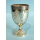 A Victorian silver and gilt goblet, with foliate engraving within woven borders, raised on