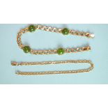A yellow metal curb-link bracelet set green cabochons, marked '333', 'xxt' and a 14k gold