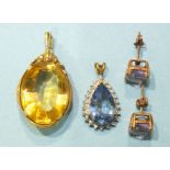 An unmarked yellow metal pendant set large oval citrine, total length 34mm, 6.8g, a 9ct gold blue