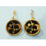 A pair of gold and onyx circular plaque drop earrings of moon and star design, the mounts marked '