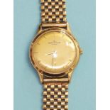 A gentleman's Jaeger LeCoultre Automatic 9ct gold wrist watch, the circular gilded dial with dart