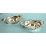 A pair of oval sweetmeat dishes with shaped scroll-edged rims, 17 x 10.5cm, Birmingham 1904,