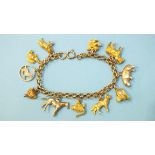 An unmarked gold fancy-link bracelet with eleven 9ct gold charms, all animals, chain length 16cm,