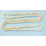 A long string of uniform cultured pearls, 7mm diameter approximately, 97cm long.