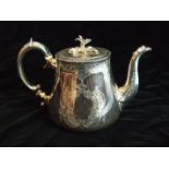 A Victorian teapot of tapered form and good gauge, with flower finial lid, the body engraved with
