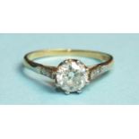 A solitaire diamond ring claw-set a brilliant-cut diamond of approximately 0.8cts, between shoulders