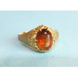 A citrine-set ring with pierced mount, on textured shank, unmarked, tests as 18ct gold