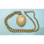 A Victorian engraved locket pendant, on 9ct gold neck chain, gross weight 19.6g.