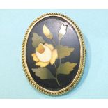 A modern pietra dura brooch set with a yellow rose, the rope-twist mount marked 'K12', 44mm x