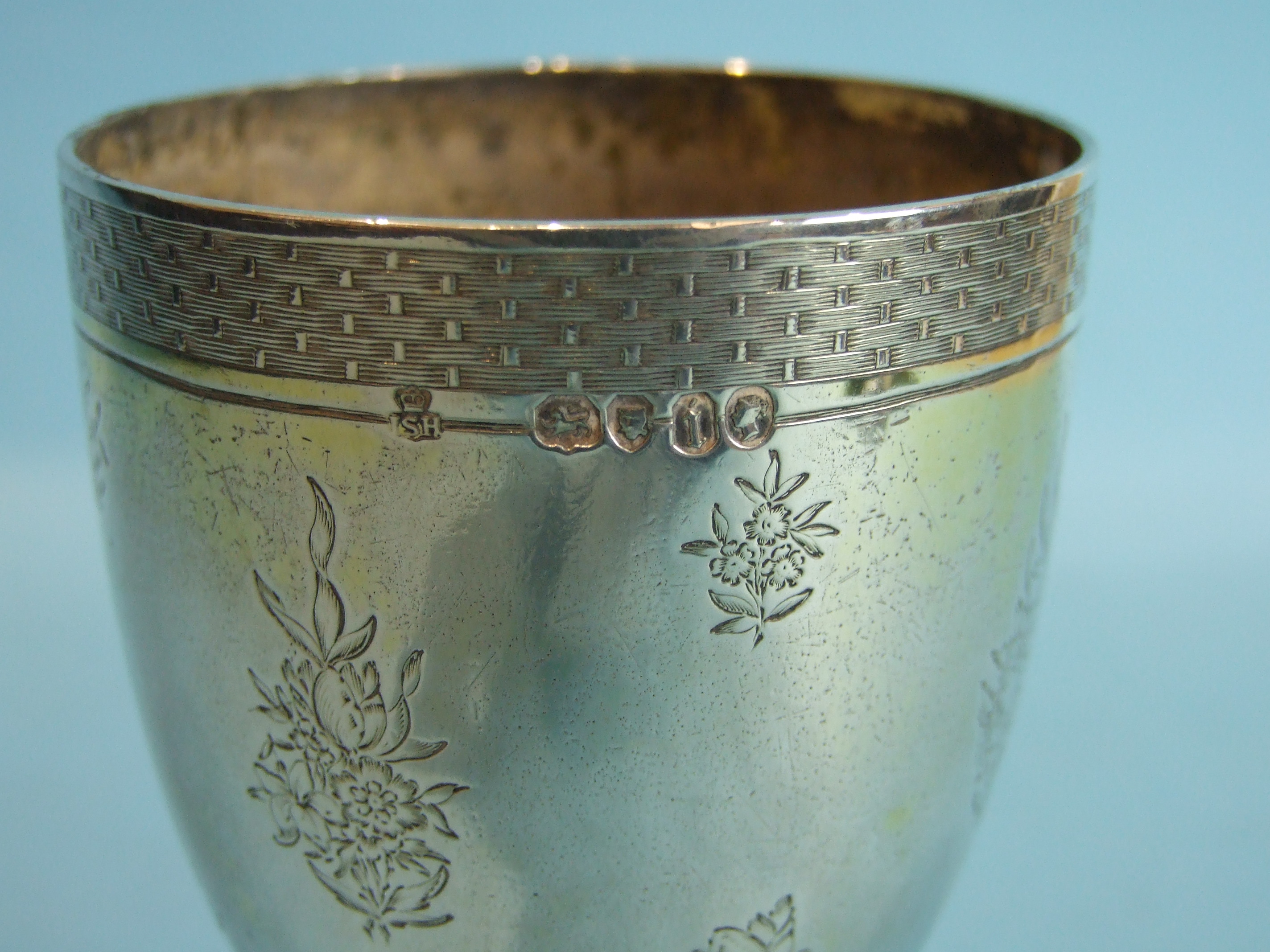 A Victorian silver and gilt goblet, with foliate engraving within woven borders, raised on - Image 4 of 6
